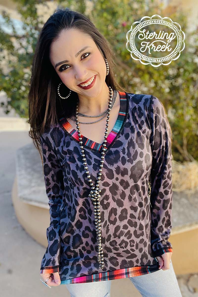 This is another reversible top that is hard to live without! This has everyones favorite two toned leopard on one side, and serape on the other. This top is long-sleeved and is so fun and made for everyone. This is comfortable, and true to size!   50% POLYESTER 45% COTTON 5% SPANDEX  Mariah is wearing - XS  Syleste is wearing - XL