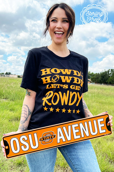 Who's ready for some football!!! This shirt is perfect for the season! We wanted a shirt to really stick out in the stands, so here it is! The orange letters really pop off this black shirt in the best way possible! The unisex fitting really makes this shirt great for all shapes and sizes!