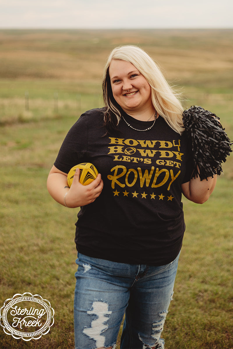 Who's ready for some football!!! This shirt is so perfect for the season!!! We wanted something to really stick out in the stands, so we gave you this tee! The sparkly gold letters really pop off of this black shirt in the best way possible! The unisex fitting make this shirt great for all shapes and sizes!  MSRP: $ 25+