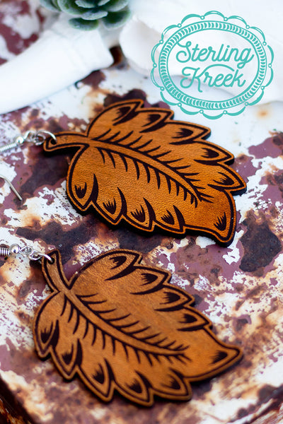 These tooled leather earrings are the perfect addition to any outfit! The leaf shape is perfect for this fall! 
