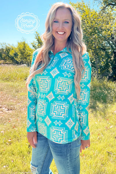 We are so proud of this pullover! The bright turquoise is so perfect for any occasion! This pullover offers a quarter zip and a full collar! This material is so soft and is made to make you feel cozy and cute! 