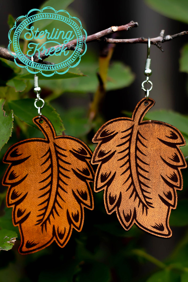 These tooled leather earrings are the perfect addition to any outfit! The leaf shape is perfect for this fall! 