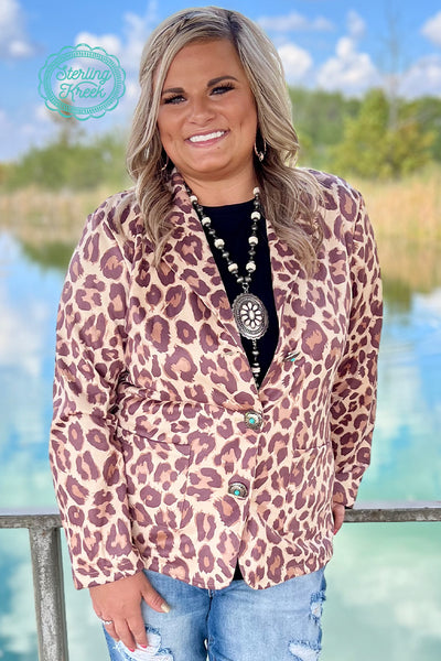 This Blazer is what you would call FIRE!! Such a flattering fit with a oh so soft feel to it! This blazer has our favorite leopard print which you can dress up or dress down! If you loved our other blazers then do not miss out on this one!!!  Kylee is wearing a Medium  Syleste is wearing an XL  90% POLYESTER 10%SPANDEX