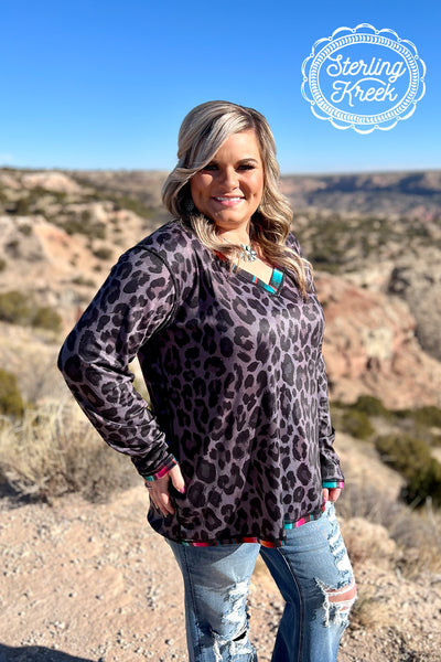 This is another reversible top that is hard to live without! This has everyones favorite two toned leopard on one side, and serape on the other. This top is long-sleeved and is so fun and made for everyone. This is comfortable, and true to size!   50% POLYESTER 45% COTTON 5% SPANDEX  Mariah is wearing - XS  Syleste is wearing - XL