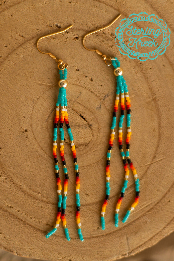 Simple seed bead long tassel earrings with turquoise/yellow/orange/white/black beads. Perfect for a pop of color for any outfit!    length-3.5"  MSRP: $10+