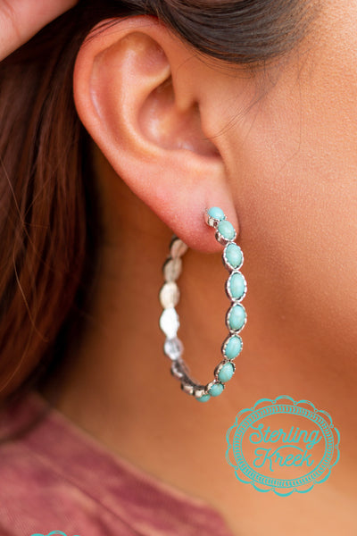 Silver plated earring with Navajo inspired turquoise hoops! We love these simple yet fashionable earrings for almost any occasion!   diameter-1.75"  MSRP: $13+